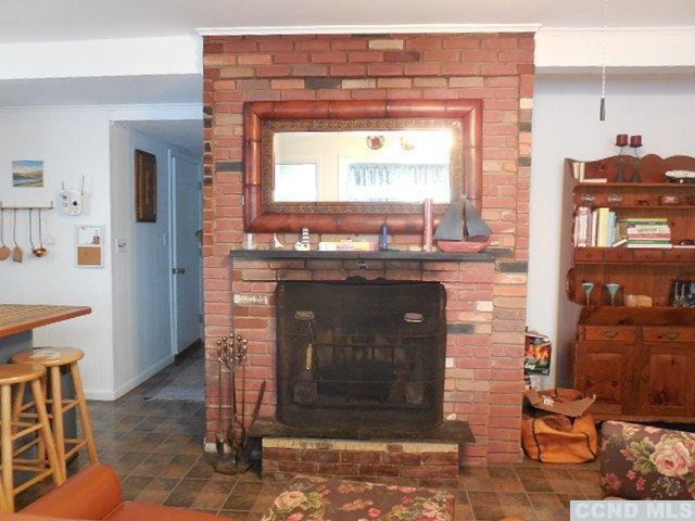 1010 Lakeview Road Copake, NY 12516 - Photo 7 of 10 a room with fireplace and cabinets