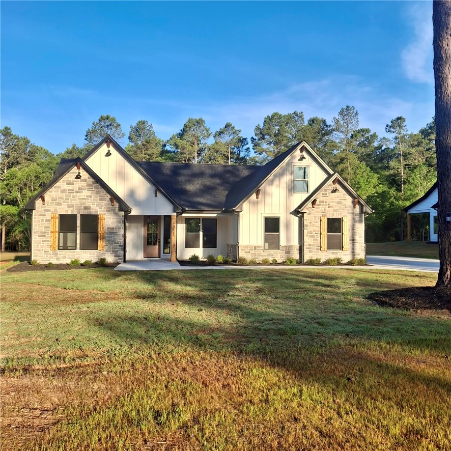 4554 Flat Rock Road Iva, SC 29655 - Photo 2 of 32 A charming stone and board and batten facade welcomes you home with architectural distinction.