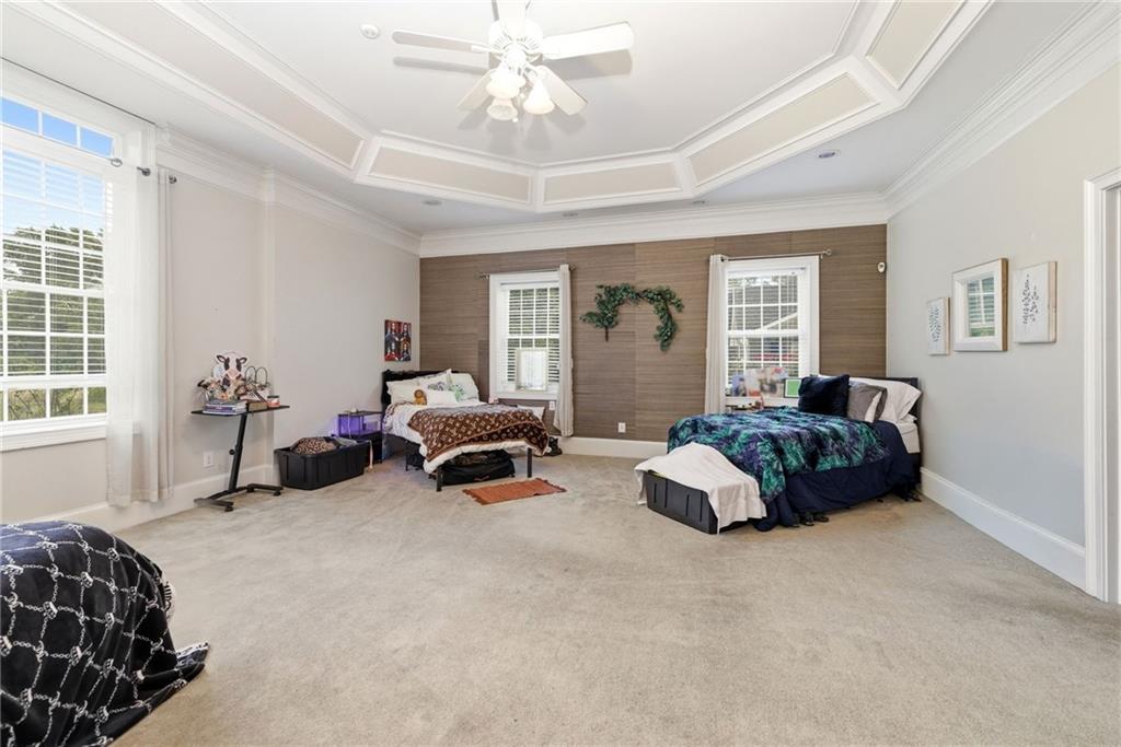 4337 Mountain View Road Oakwood, GA 30566 - Photo 23 of 84 a spacious bedroom with a bed and a couch