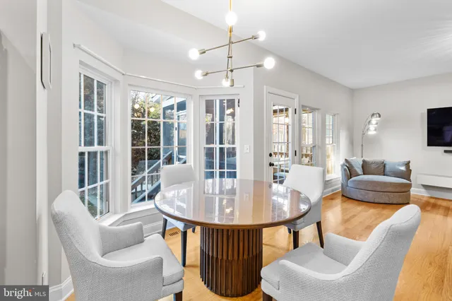 a living room with furniture and a lamp