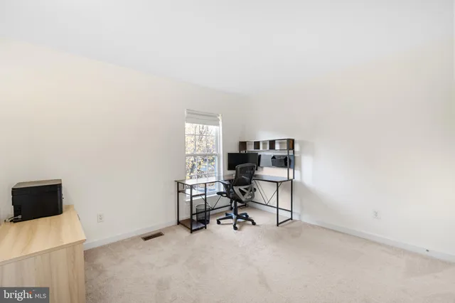 an empty room with white walls and white walls