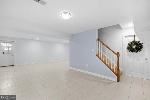 a balcony with furniture and wooden floor