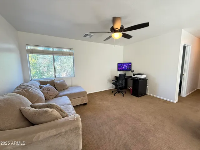 a living room with furniture and window