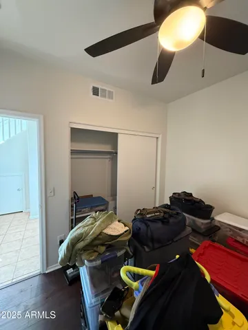 a bedroom with a bed and a mirror