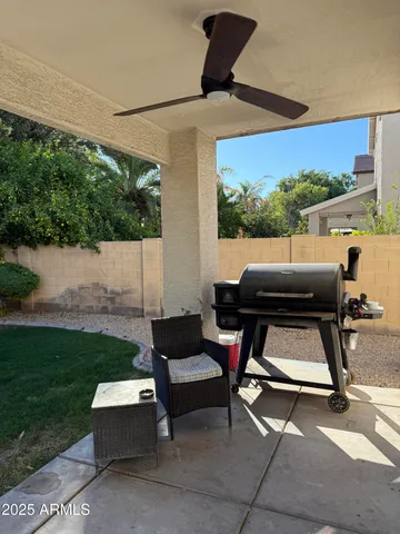 a view of a house with a backyard porch and a garden