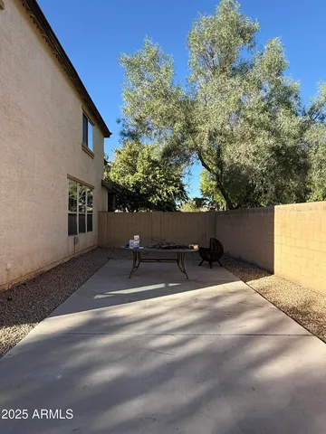 a view of yard with swimming pool and outdoor seating