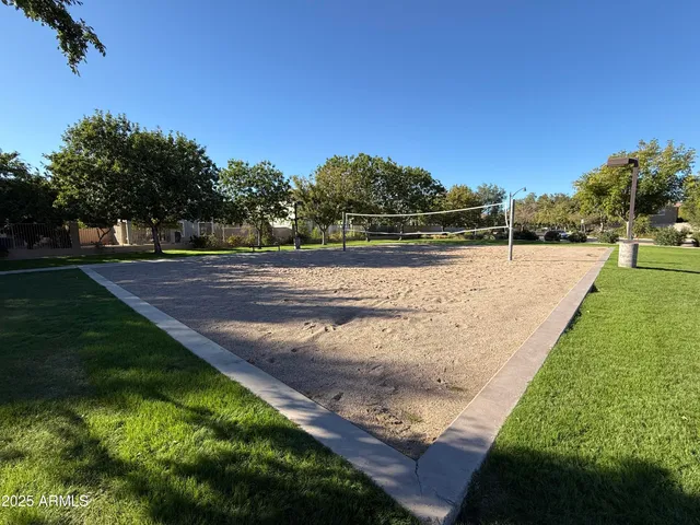 a view of swimming pool with yard and green space