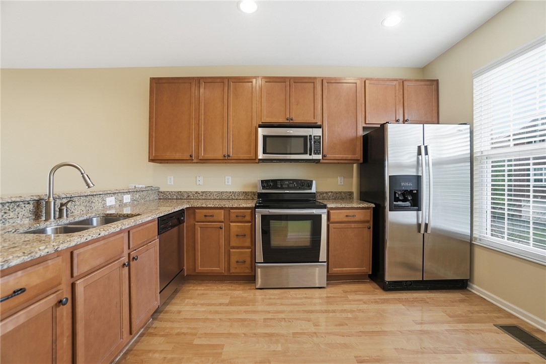 4324 Straight Arrow Road Dayton, OH 45430 - Photo 13 of 40 This functional kitchen features ample cabinetry, durable countertops, and sleek stainless steel appliances.