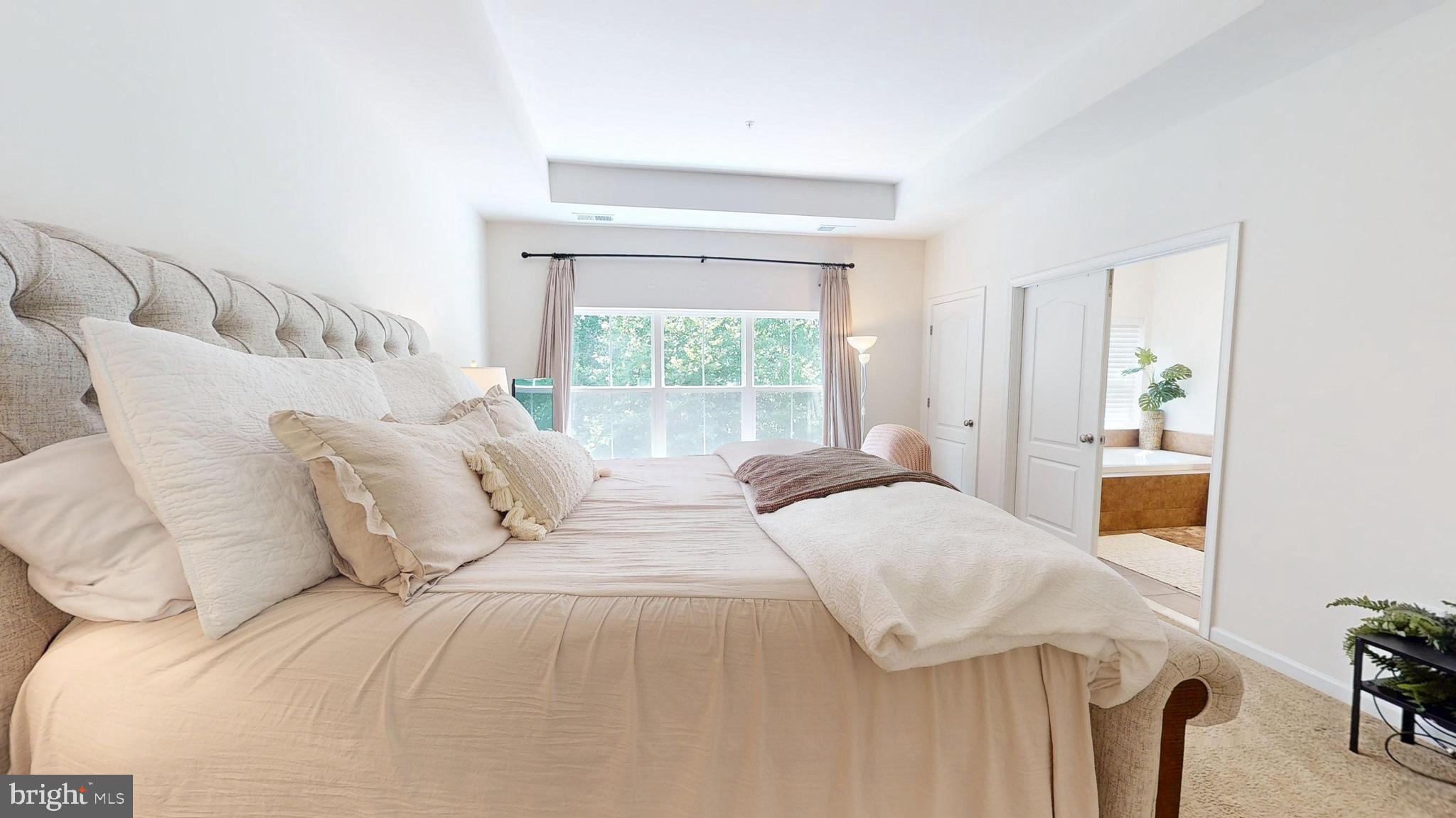 15103 Hogshead Way Upper Marlboro, MD 20772 - Photo 23 of 44 a bedroom with a large bed and a window