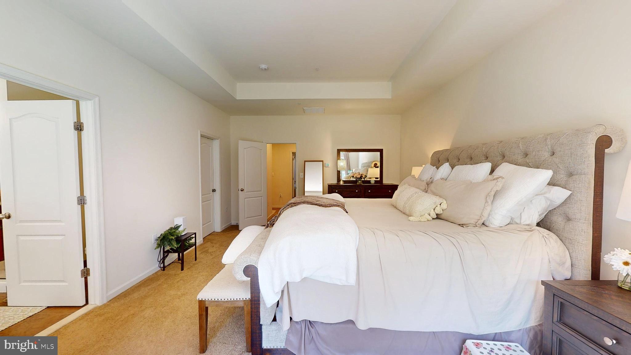 15103 Hogshead Way Upper Marlboro, MD 20772 - Photo 26 of 44 a bed sitting in a bedroom and chandelier