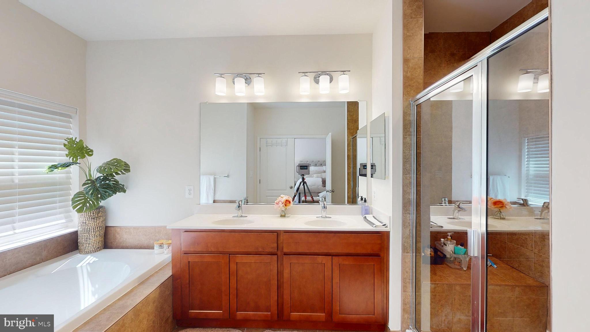 15103 Hogshead Way Upper Marlboro, MD 20772 - Photo 27 of 44 a bathroom with a sink and a mirror