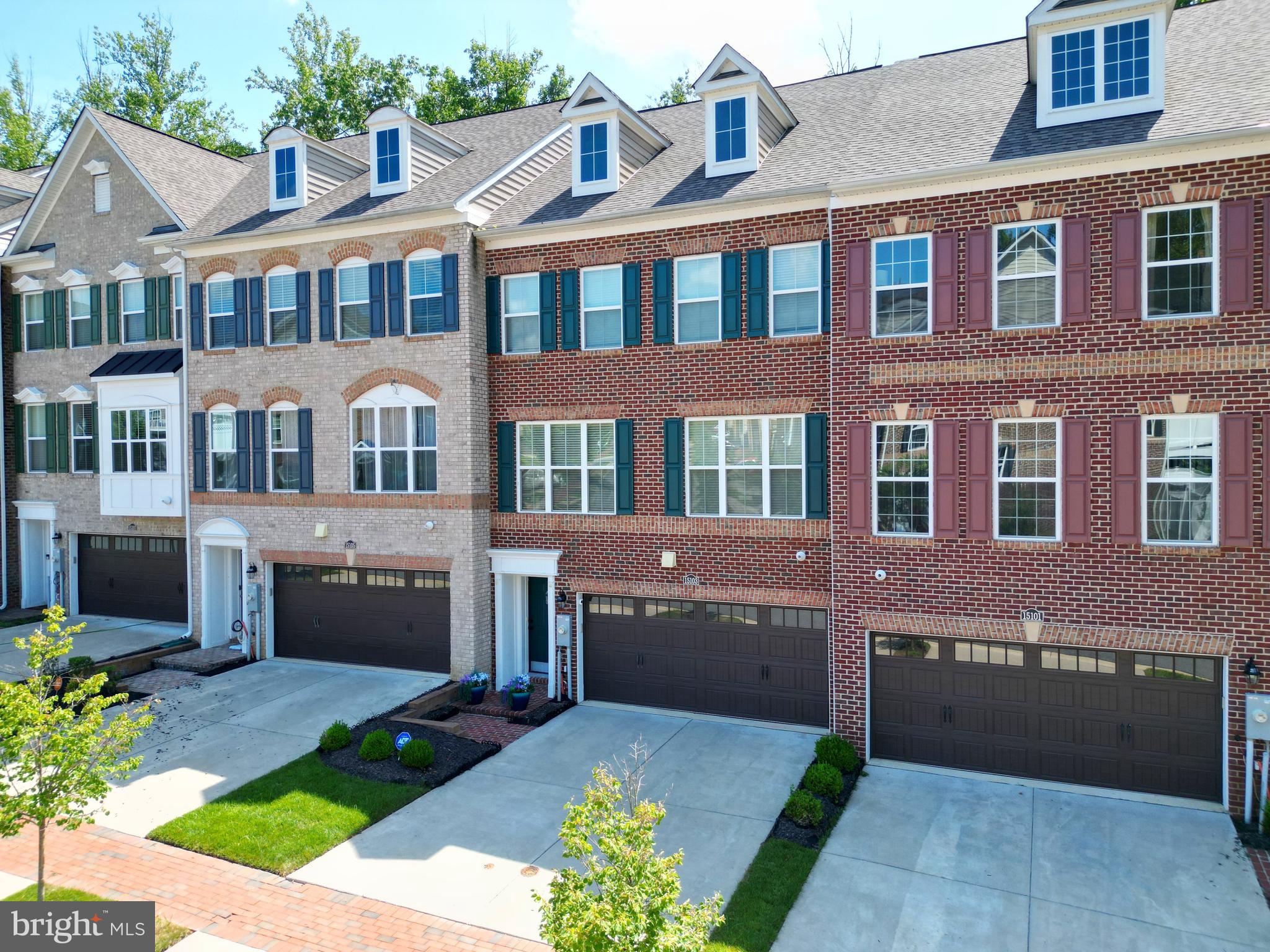 15103 Hogshead Way Upper Marlboro, MD 20772 - Photo 3 of 44 a front view of a building with a garden