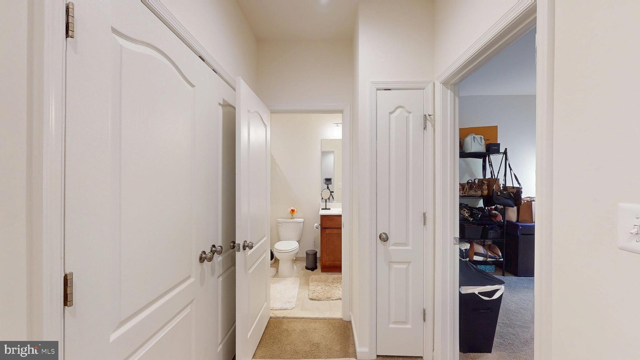 15103 Hogshead Way Upper Marlboro, MD 20772 - Photo 34 of 44 a view of a hallway with wooden floor and closet