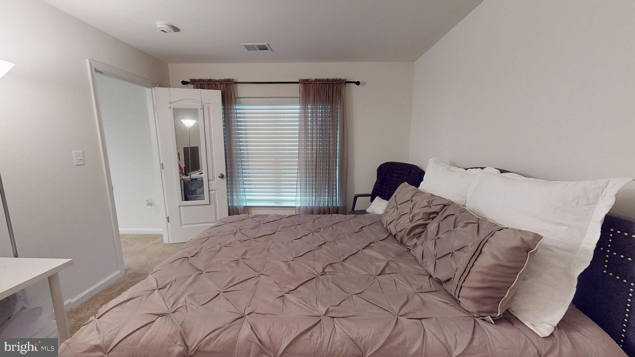 15103 Hogshead Way Upper Marlboro, MD 20772 - Photo 41 of 44 a bedroom with a bed and a window