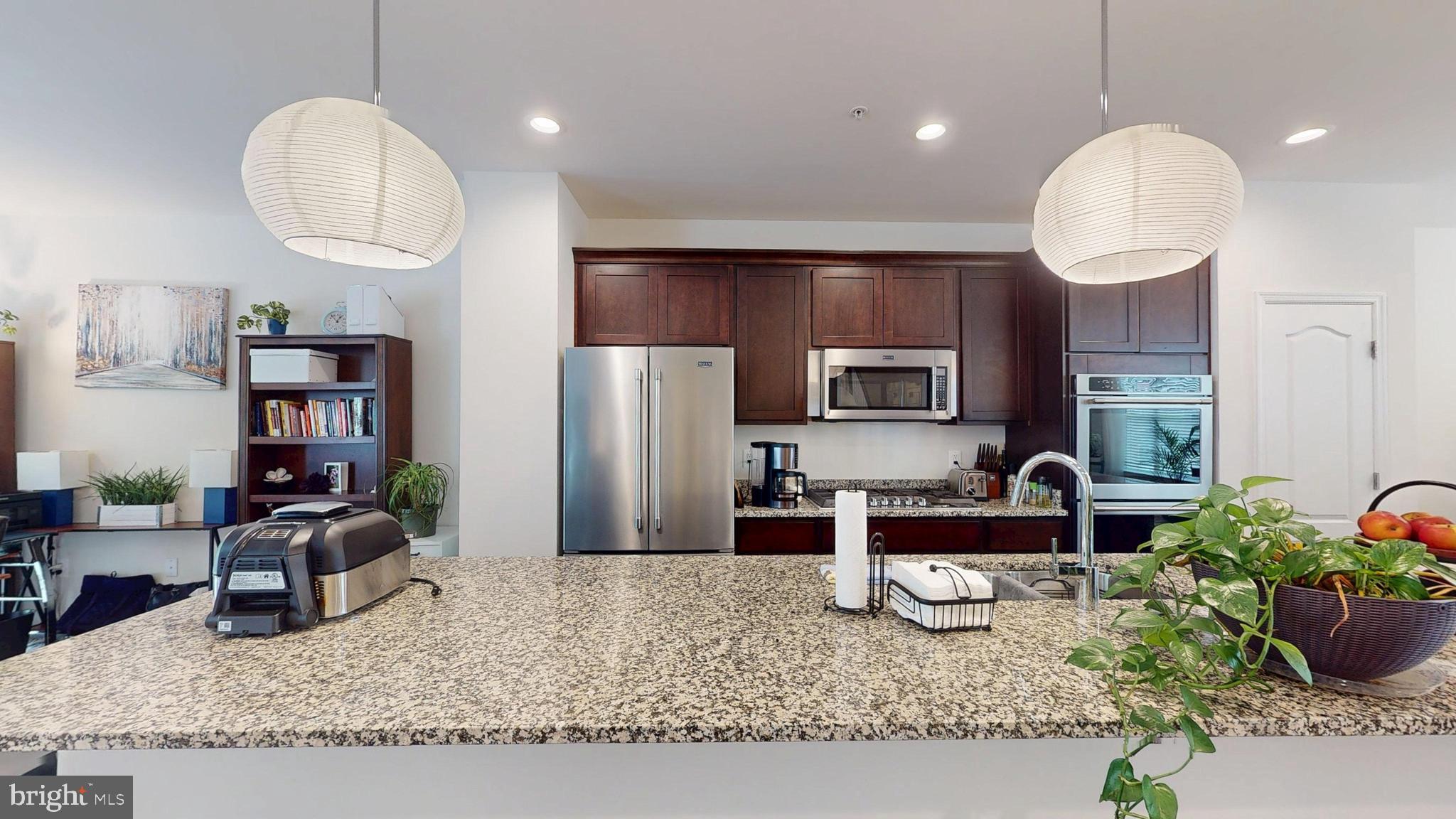 15103 Hogshead Way Upper Marlboro, MD 20772 - Photo 5 of 44 a kitchen with sink and refrigerator