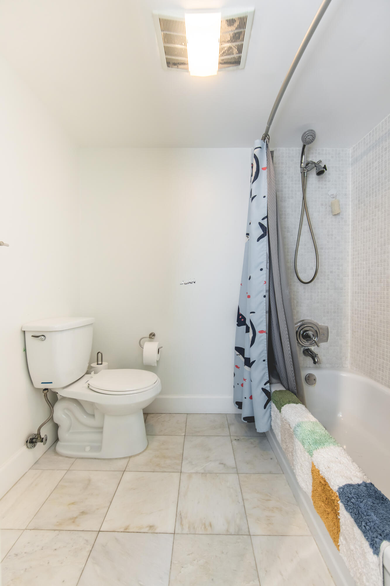 501 Southwest 11th Place, Unit 101 Boca Raton, FL 33432 - Photo 4 of 22 a bathroom with a toilet and a shower