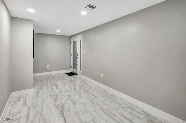 a view of a balcony with outdoor seating