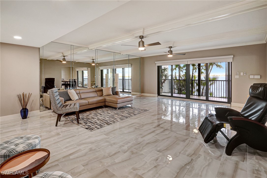 1900 Virginia Avenue, Unit 103 Fort Myers, FL 33901 - Photo 5 of 45 a living room with furniture and a large window