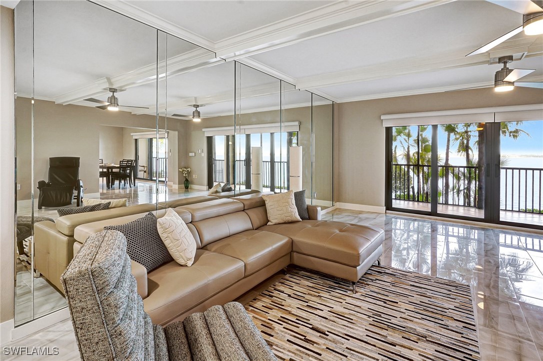 1900 Virginia Avenue, Unit 103 Fort Myers, FL 33901 - Photo 6 of 45 a living room with furniture and a large window