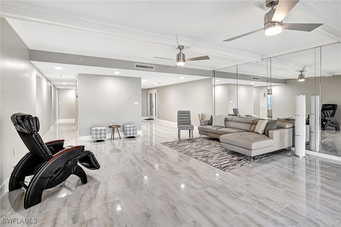 1900 Virginia Avenue, Unit 103 Fort Myers, FL 33901 - Photo 7 of 45 a living room with furniture and a chandelier