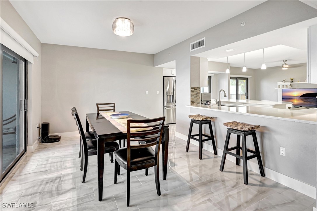 1900 Virginia Avenue, Unit 103 Fort Myers, FL 33901 - Photo 10 of 45 a view of a dining area with furniture