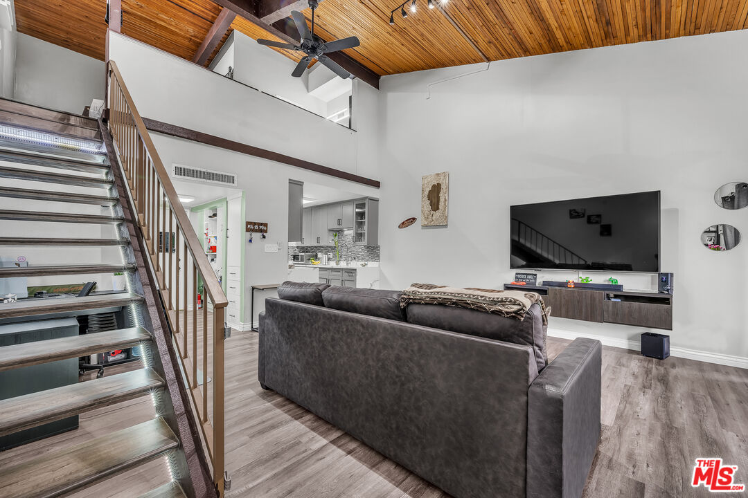 5460 White Oak Avenue, Unit D309 Encino, CA 91316 - Photo 1 of 22 a living room with furniture and a flat screen tv