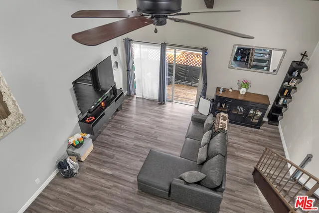 a bed room with a bed and a refrigerator