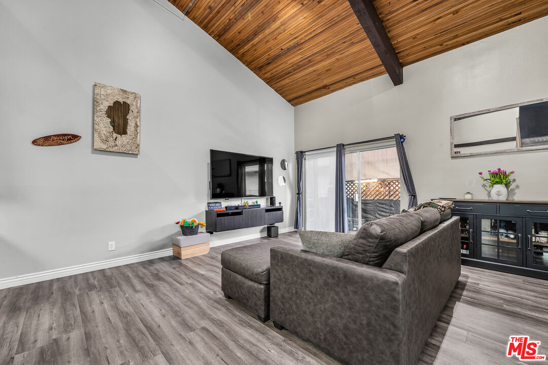 5460 White Oak Avenue, Unit D309 Encino, CA 91316 - Photo 4 of 22 a living room with furniture and a flat screen tv