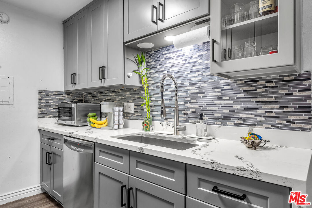 5460 White Oak Avenue, Unit D309 Encino, CA 91316 - Photo 5 of 22 a kitchen with a sink and a stove
