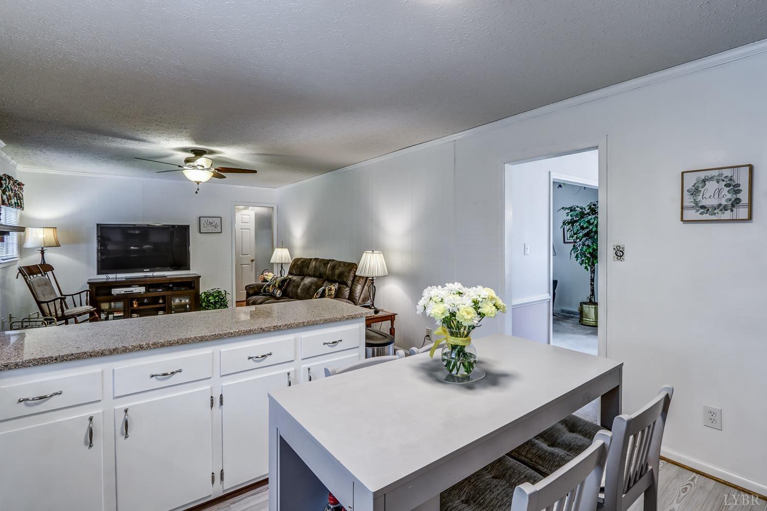 759 Farfields Drive Lynchburg, VA 24502 - Photo 17 of 53 a kitchen with a table and chairs in it