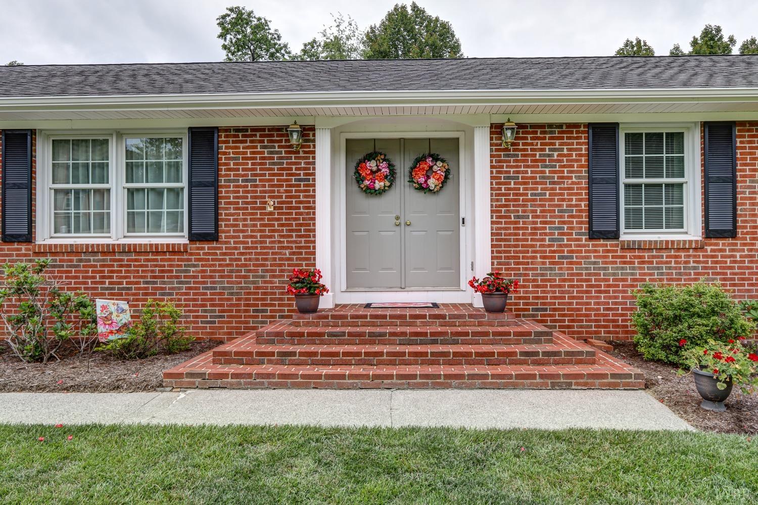 759 Farfields Drive Lynchburg, VA 24502 - Photo 2 of 53 a front view of a house with a yard and outdoor seating
