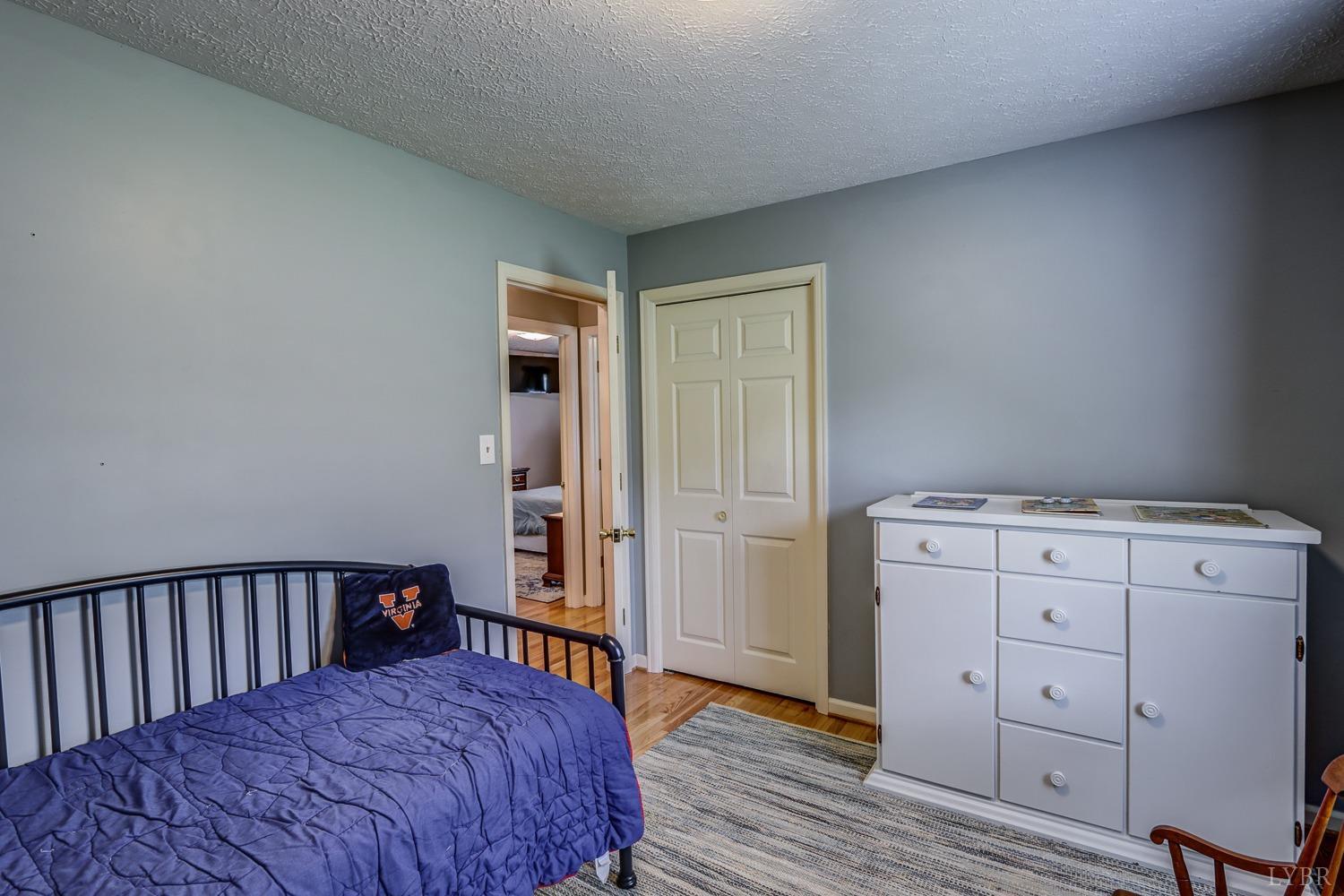 759 Farfields Drive Lynchburg, VA 24502 - Photo 32 of 53 a bedroom with a bed and wooden floor