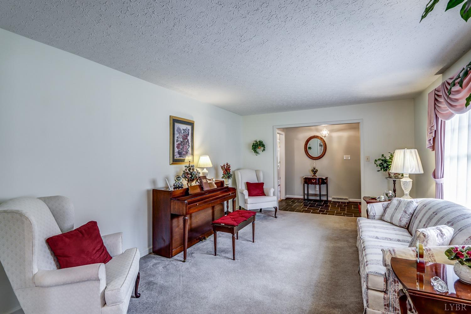 759 Farfields Drive Lynchburg, VA 24502 - Photo 9 of 53 a living room with furniture and a large window