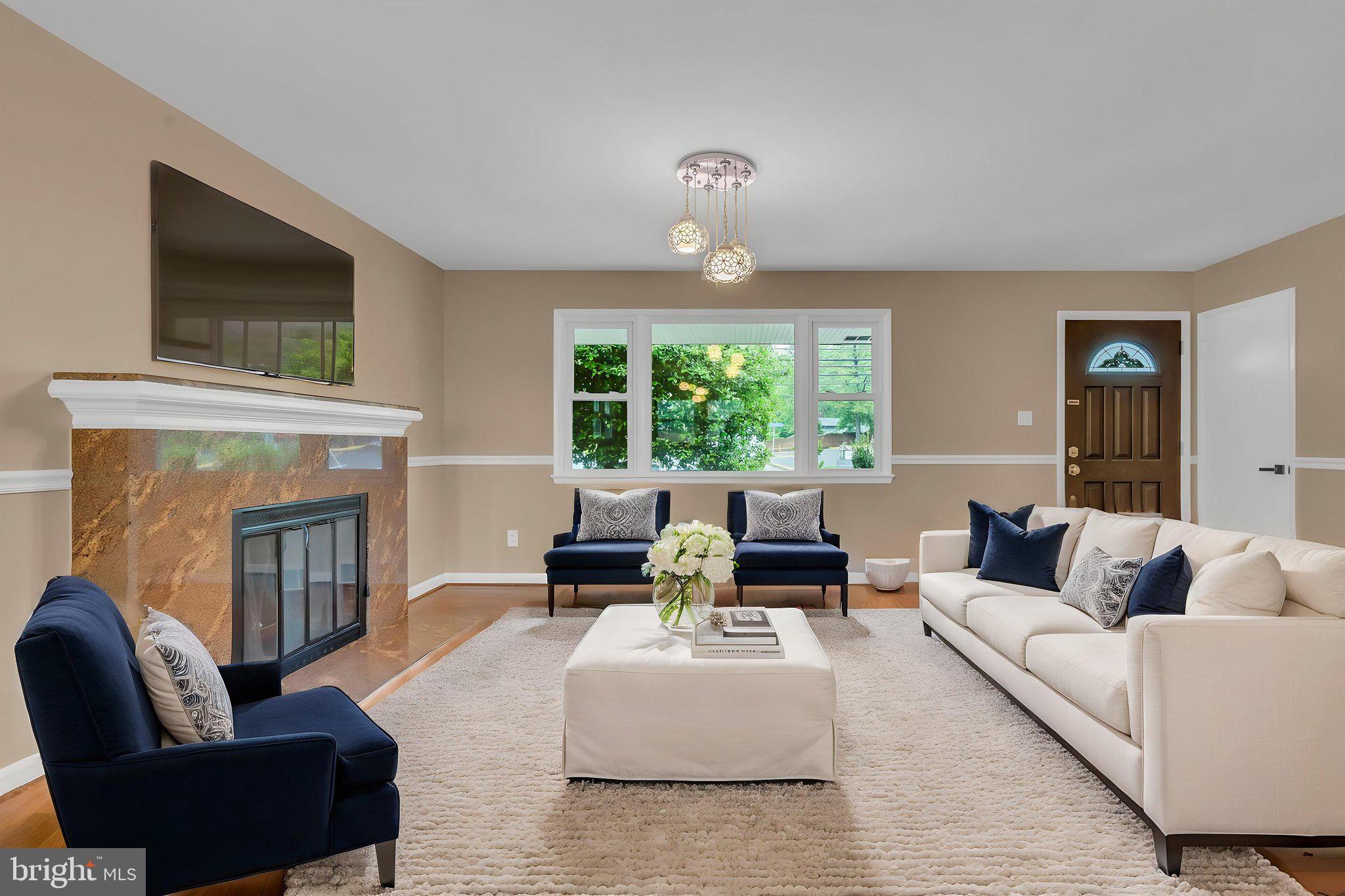 6809 Braddock Road Springfield, VA 22151 - Photo 12 of 60 a living room with furniture and a fireplace