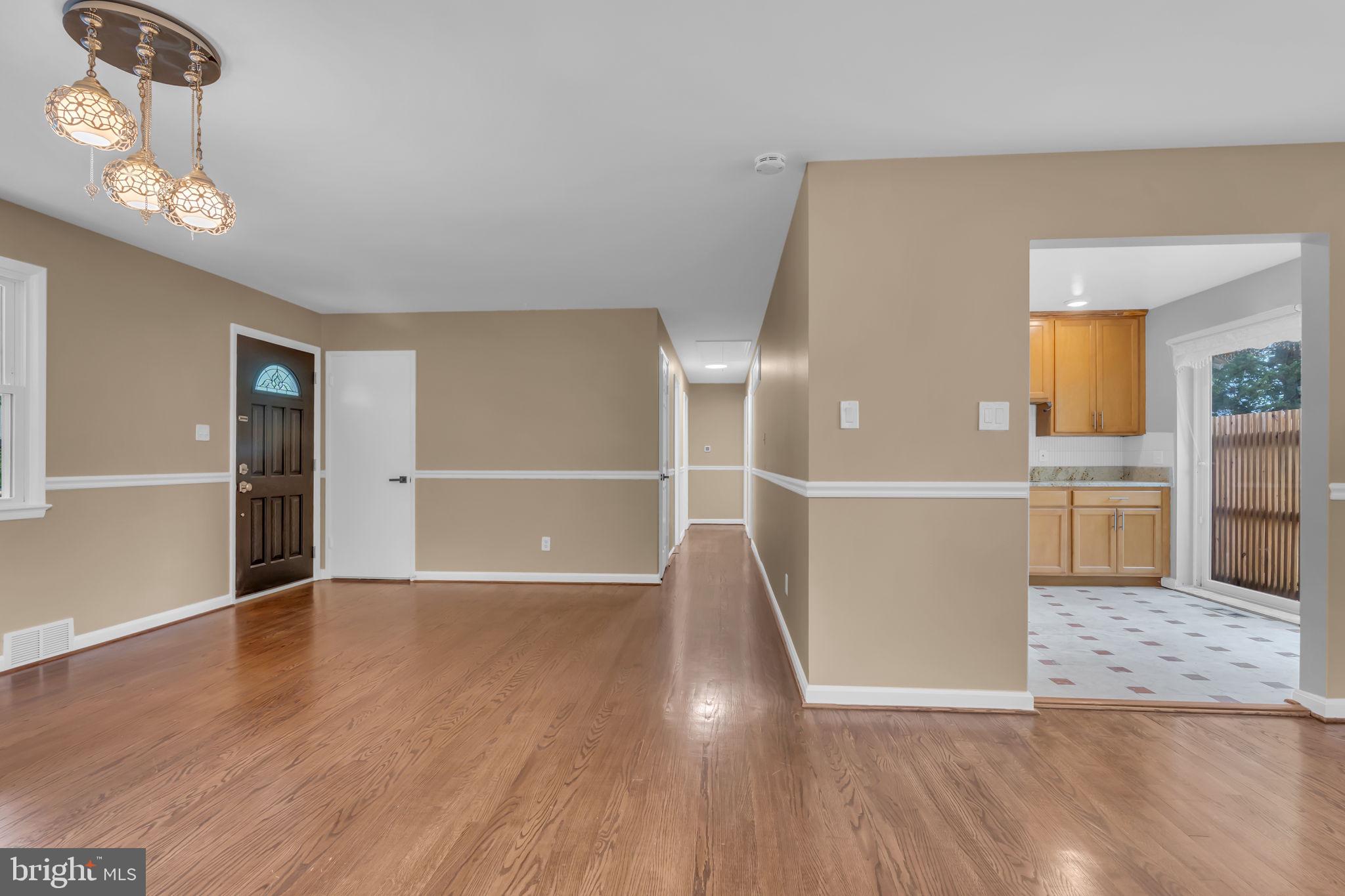 6809 Braddock Road Springfield, VA 22151 - Photo 14 of 60 a view of a kitchen with wooden floor and a refrigerator