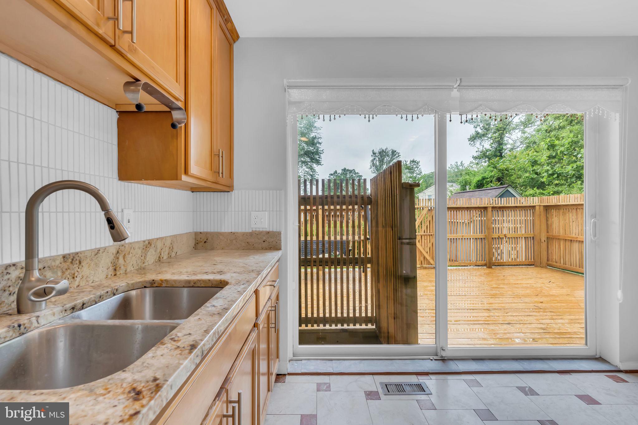 6809 Braddock Road Springfield, VA 22151 - Photo 18 of 60 a kitchen with a sink and a large window