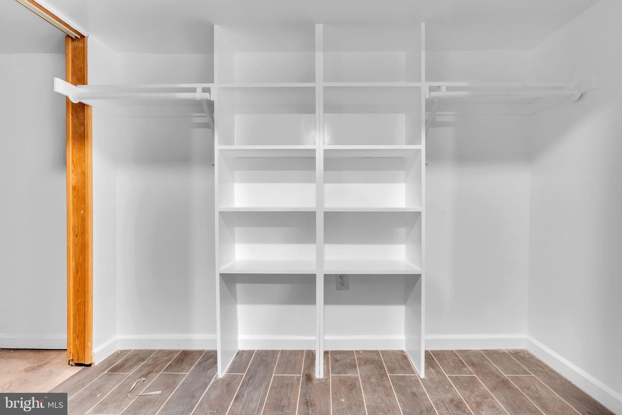 6809 Braddock Road Springfield, VA 22151 - Photo 35 of 60 a view of walk in closet with empty racks