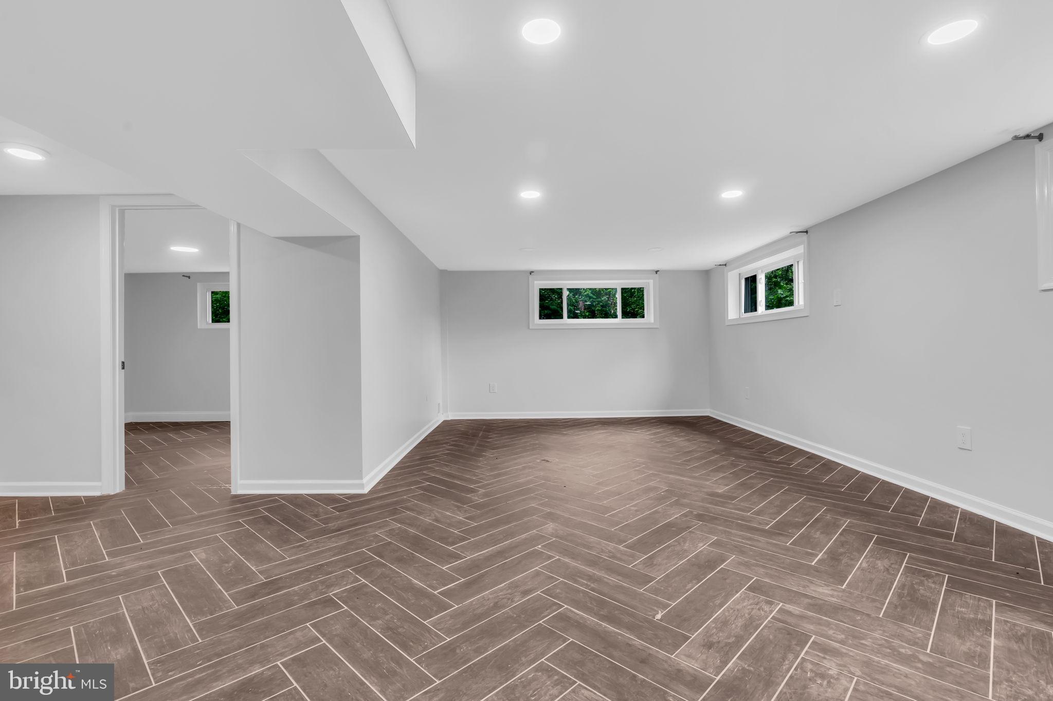 6809 Braddock Road Springfield, VA 22151 - Photo 42 of 60 a view of empty room with wooden floor