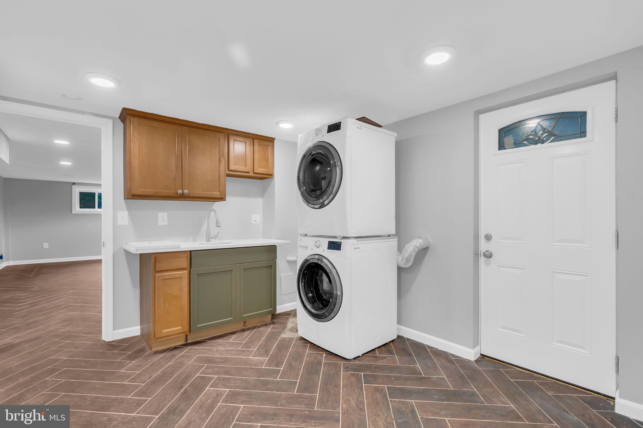 6809 Braddock Road Springfield, VA 22151 - Photo 47 of 60 a view of kitchen with a sink dryer and washer