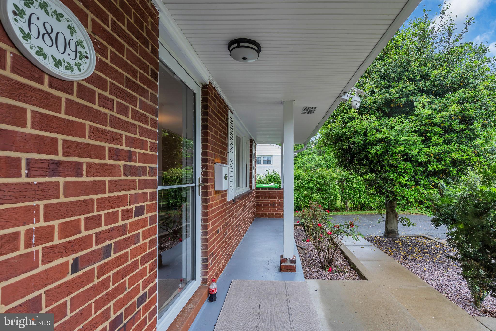 6809 Braddock Road Springfield, VA 22151 - Photo 5 of 60 a view of a pathway along the building