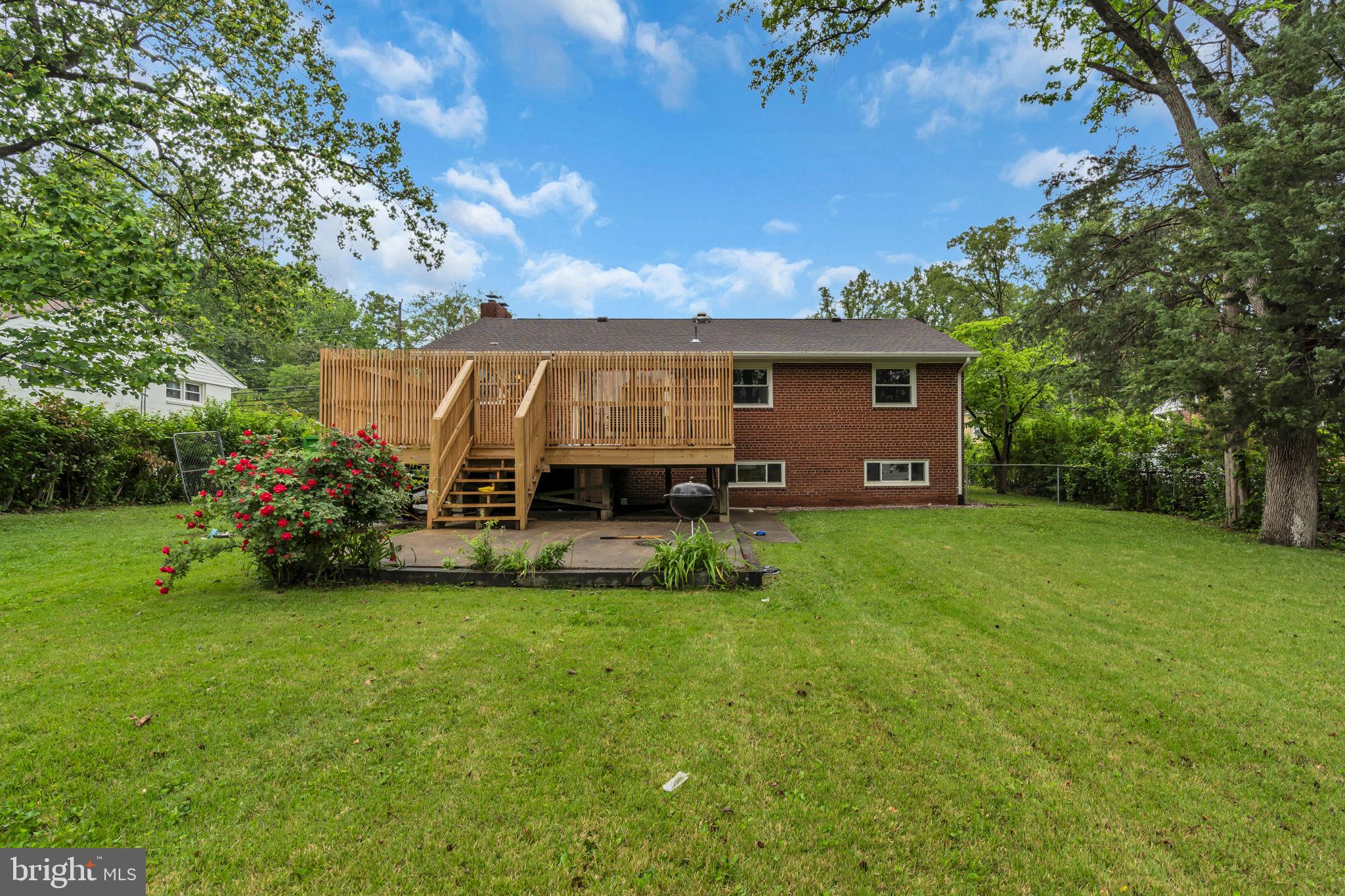 6809 Braddock Road Springfield, VA 22151 - Photo 52 of 60 a view of a house with backyard and a tree