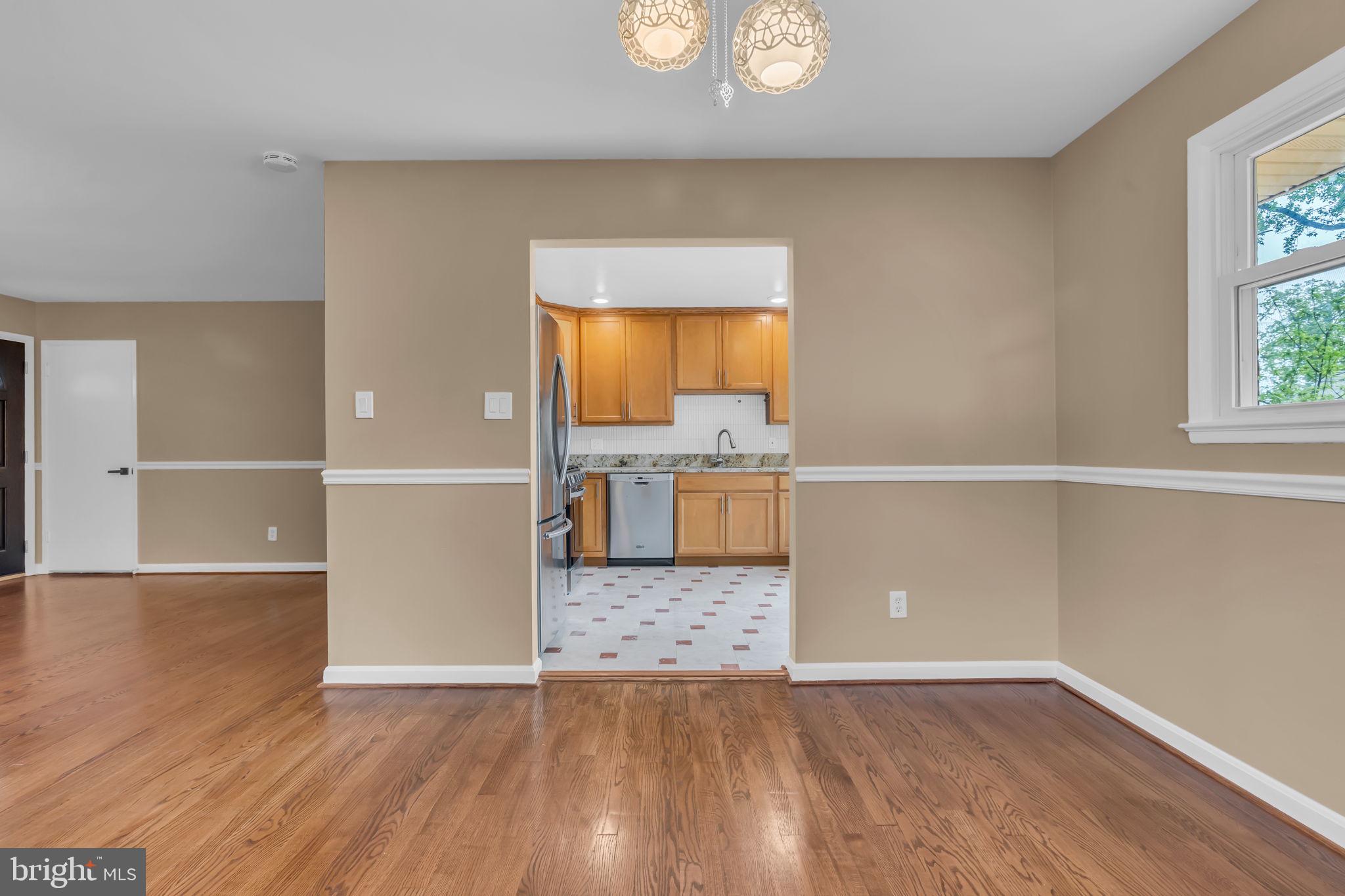 6809 Braddock Road Springfield, VA 22151 - Photo 10 of 60 a view of kitchen with furniture and wooden floor