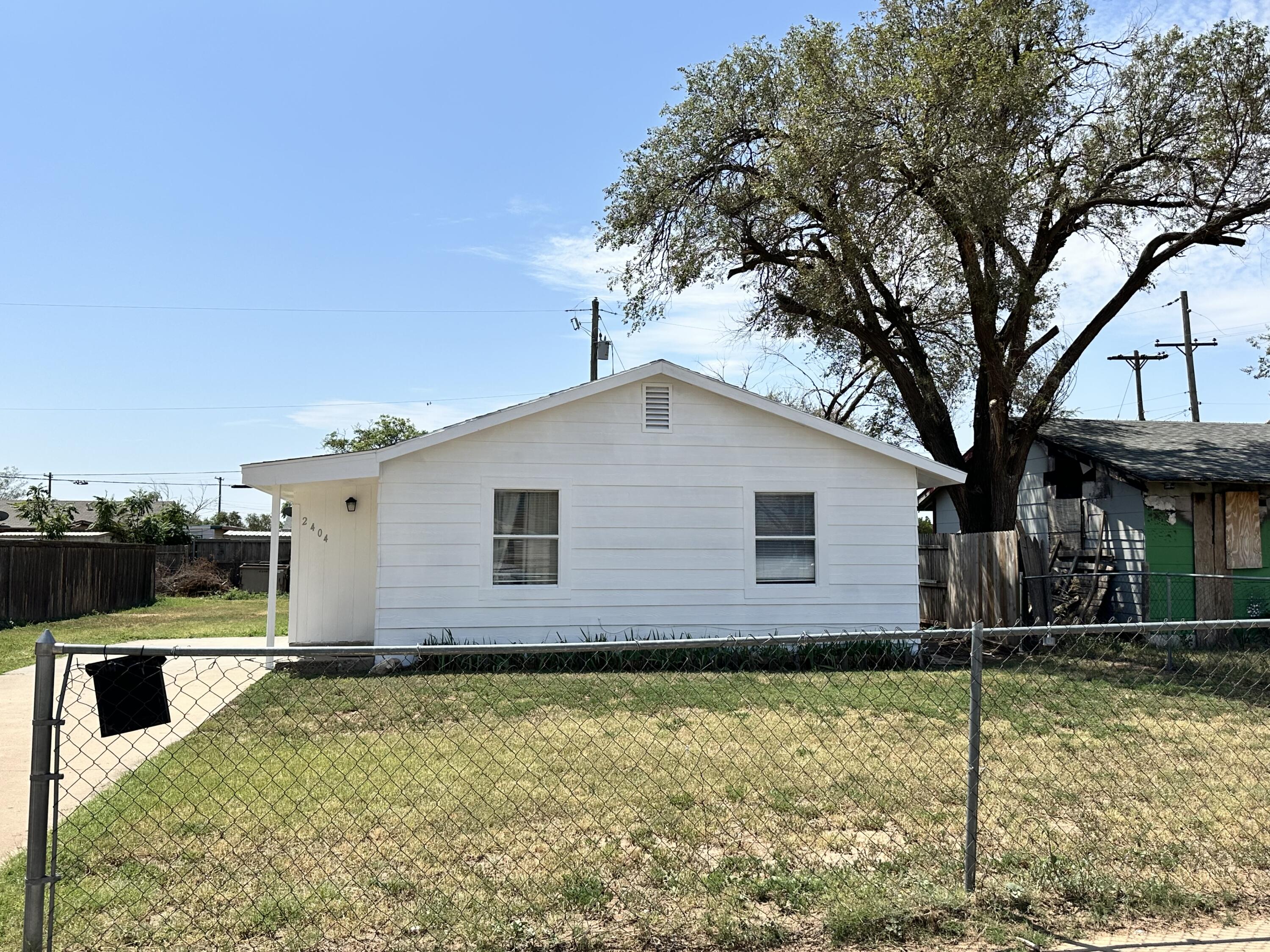 2404 East 5th Street Lubbock, TX 79403 - Photo 13 of 14 a view of a house with a yard