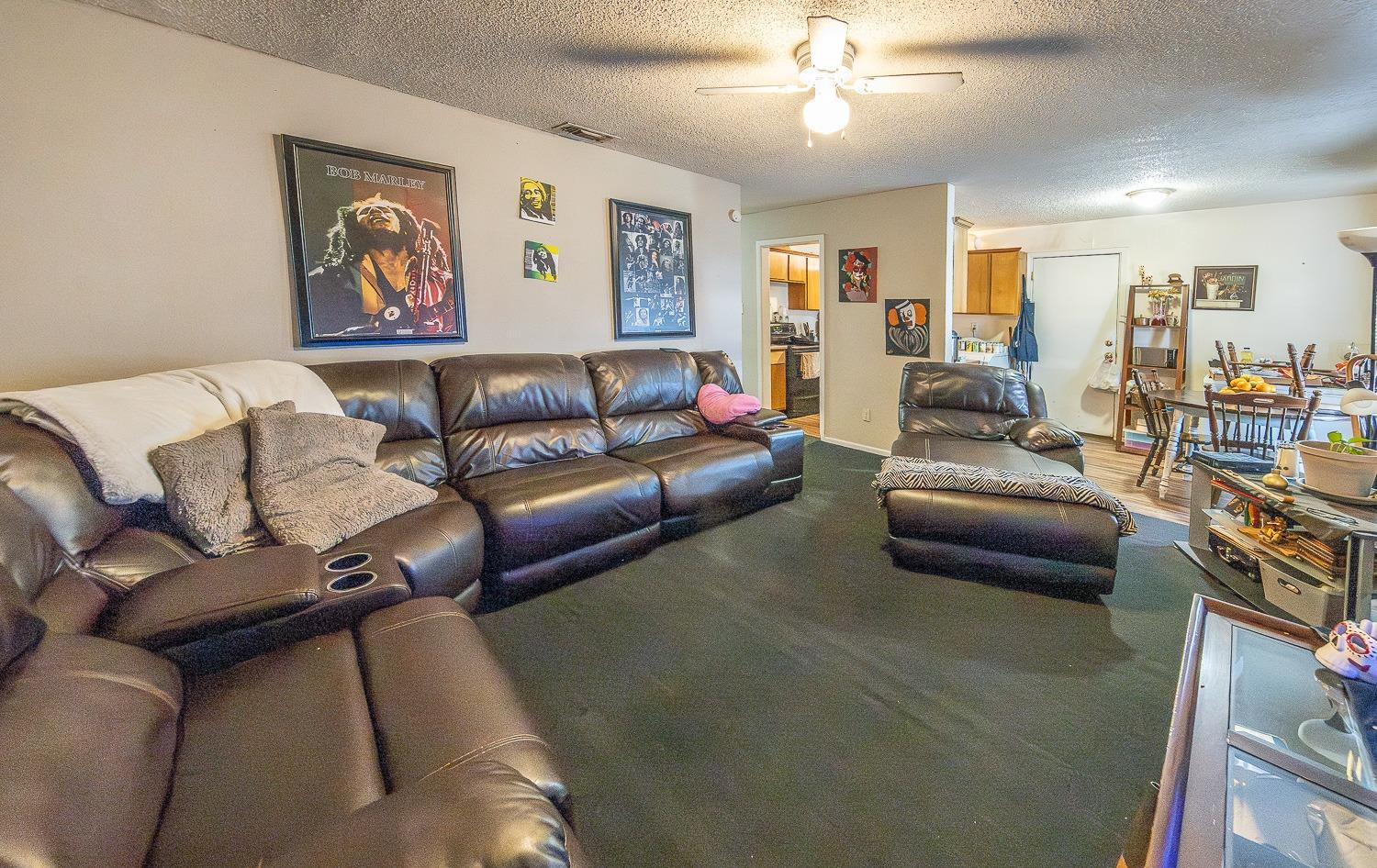 2404 East 5th Street Lubbock, TX 79403 - Photo 2 of 14 a living room with furniture and a ceiling fan