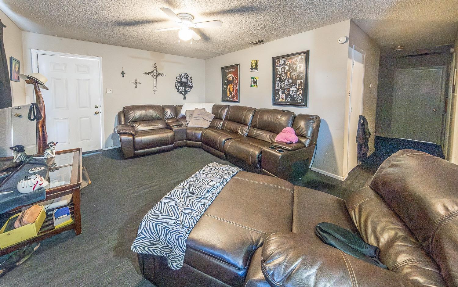 2404 East 5th Street Lubbock, TX 79403 - Photo 6 of 14 a living room with furniture and a flat screen tv
