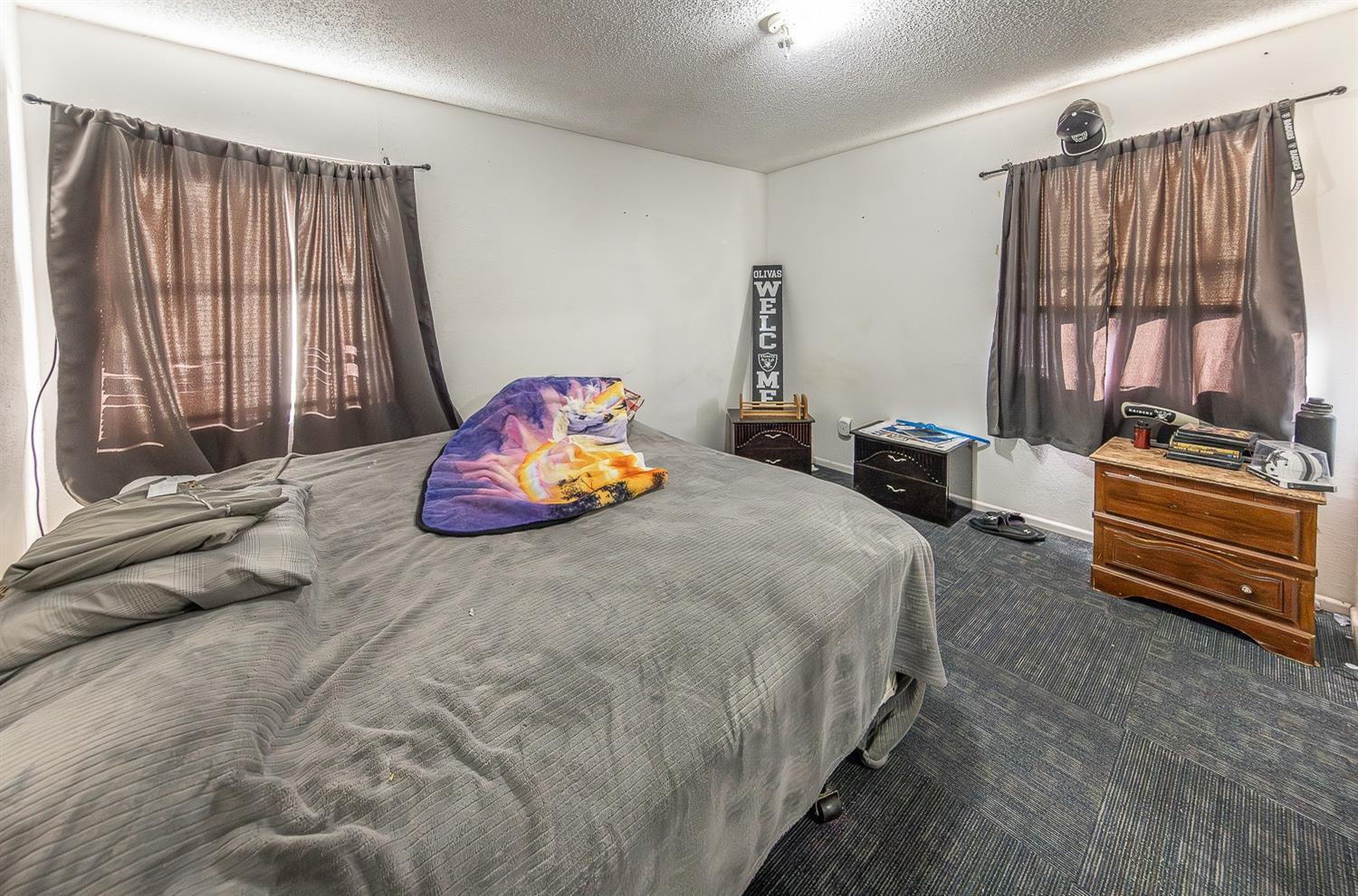2404 East 5th Street Lubbock, TX 79403 - Photo 10 of 14 a bedroom with a bed and a window