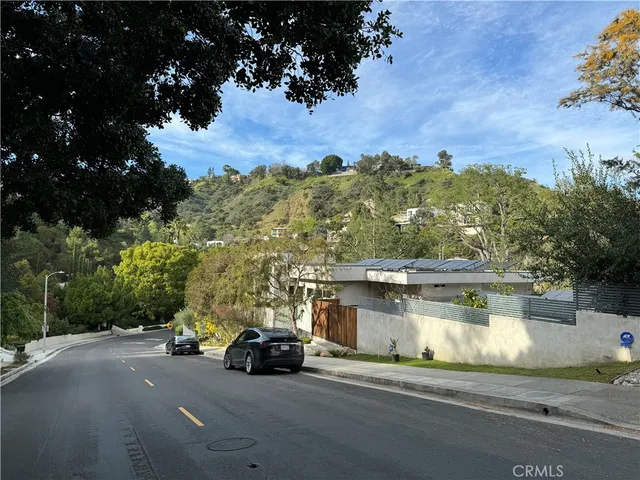 a view of a car parked on the side of a road