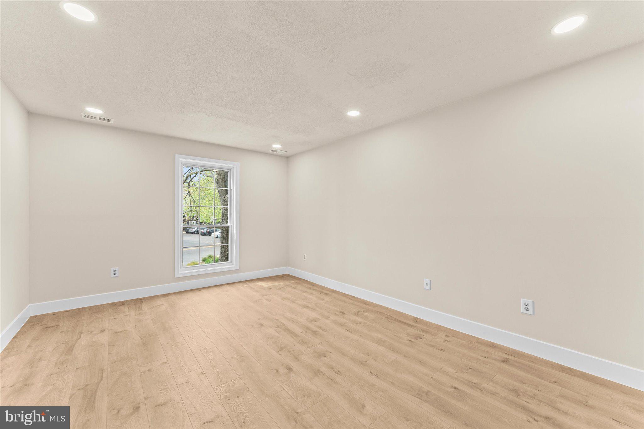 10066 Oakton Terrace Road, Unit 10066 Oakton, VA 22124 - Photo 14 of 27 a view of an empty room with a window