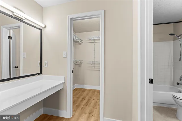 a bathroom with a shower and a sink