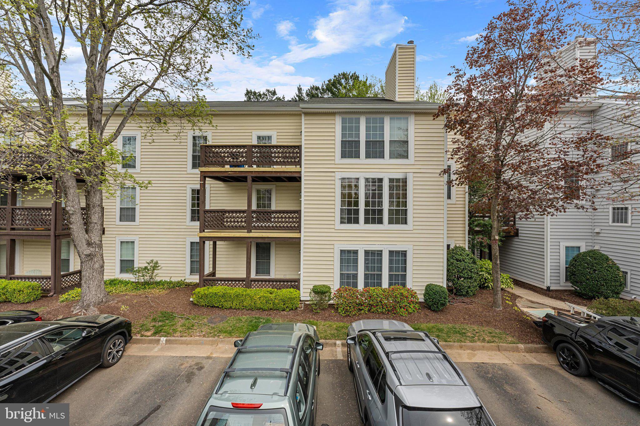 10066 Oakton Terrace Road, Unit 10066 Oakton, VA 22124 - Photo 25 of 27 front view of a house with a yard